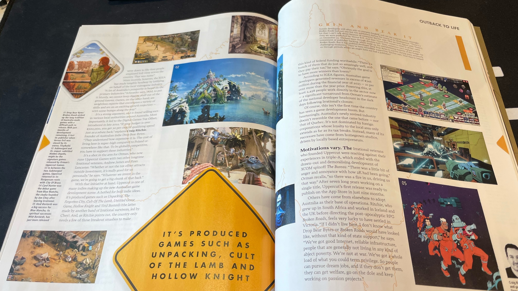 Photo of an open magazine laying on a desk. The article on display is about the game development scene in Australia.