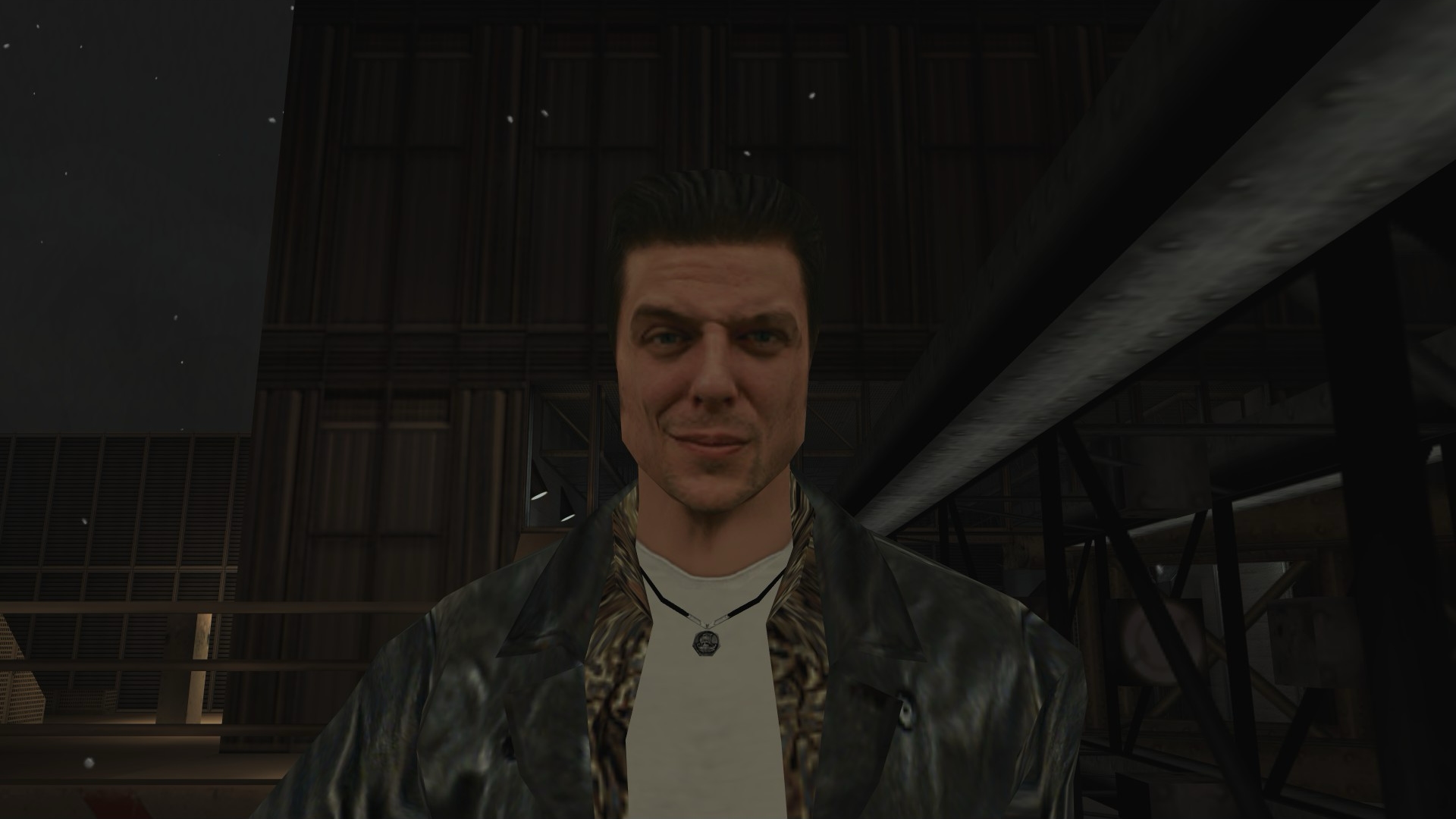 Screenshot of the Max Payne video game showing a closeup of the protagonist's face with his iconic smug grin.